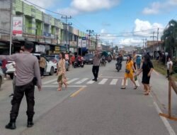 Wujud Nyata Pelayanan Polri, Polsek Parindu Amankan Misa Minggu di Pusat Damai